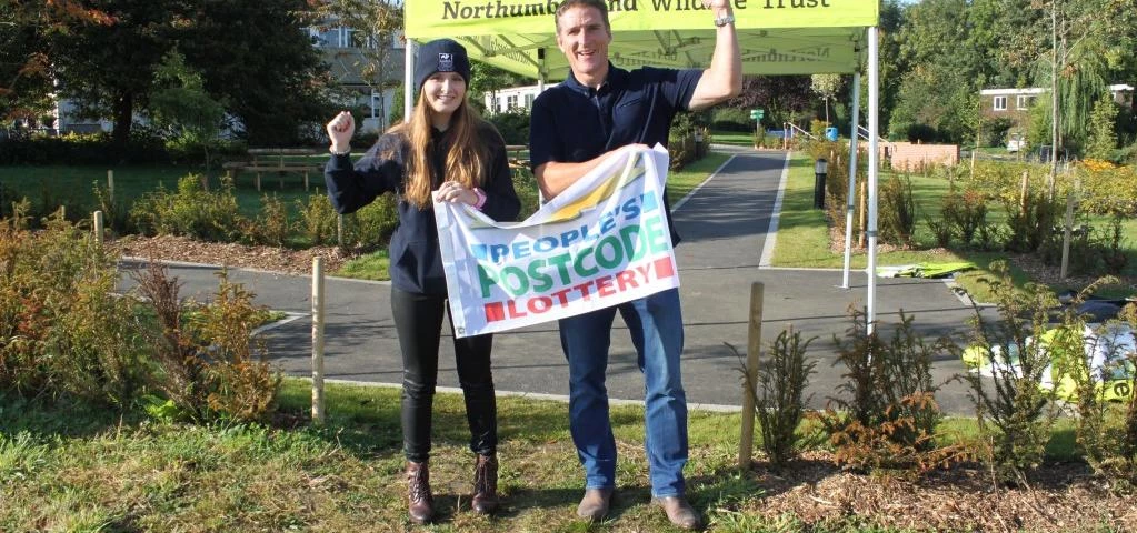 Waving the flag in celebration of the additional cash, Georgina Moroney and Countryfile presenter Io