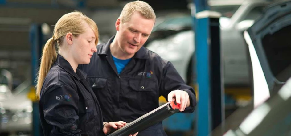 A young female mechanic with a male mechanic from BT Fleet. Image credit: BT Fleet, LinkedIn