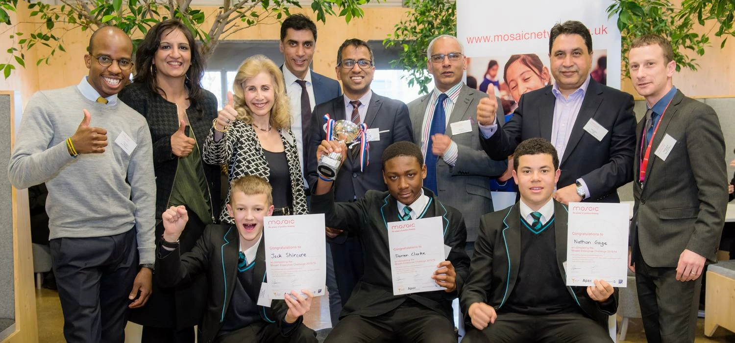The winning team celebrate with the mentor and the competition judges