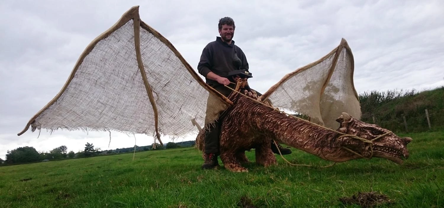 Simon O' Rourke on his prize winning wooden dragon. 