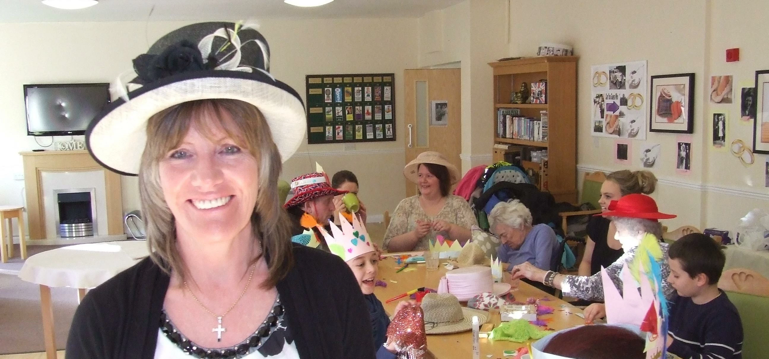 Care home manager Bev Milson with residents and Nicky's childminding 