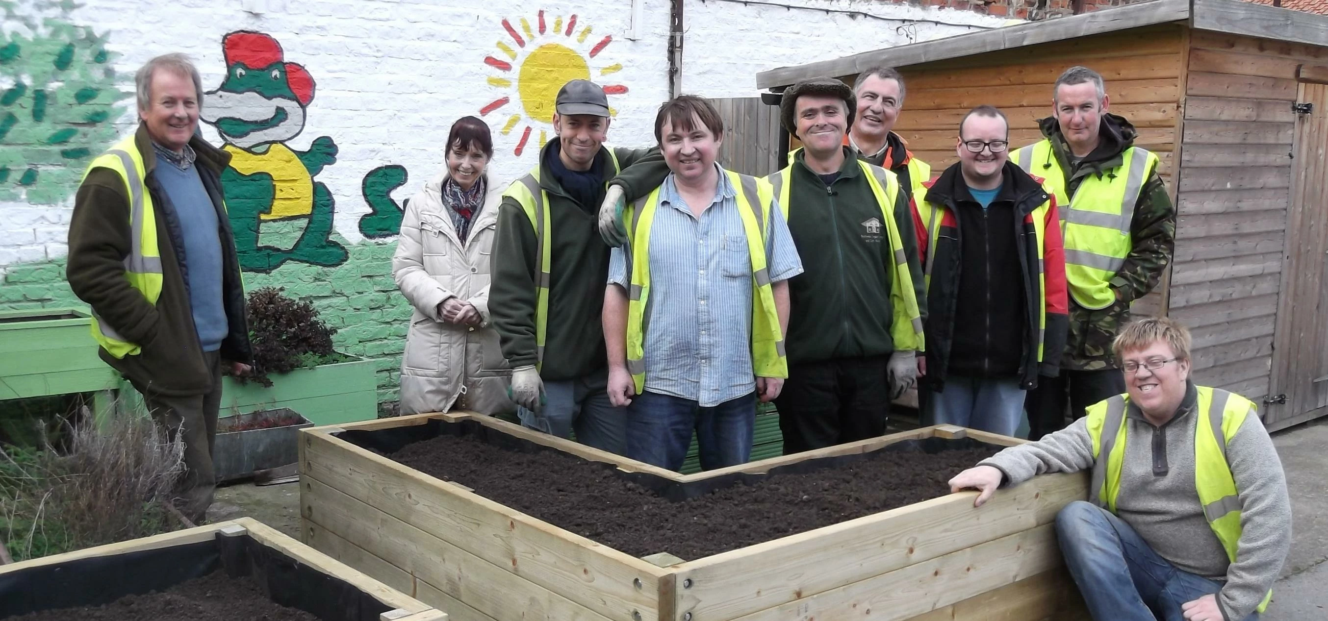 S Harrison help build planting boxes for charity Snappy
