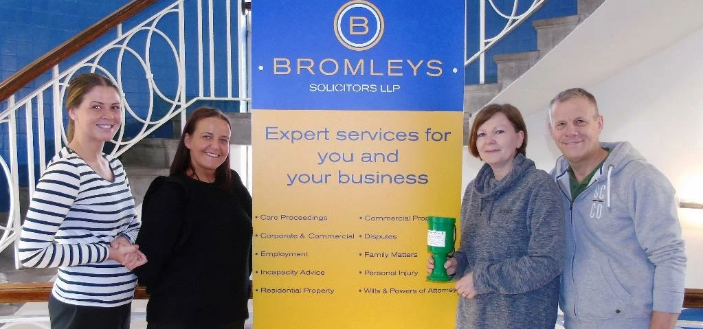 L-R Lauren Taylor and Jill Lomas of Bromleys' charity committee, with Anthony Seddon's mother Donna