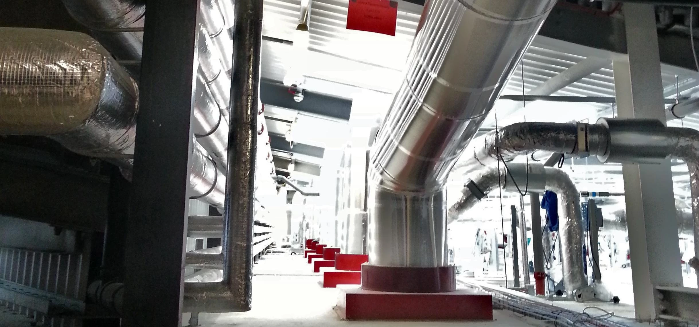 Roxtec fire collars (coloured red) fitted on Solatube light conduits