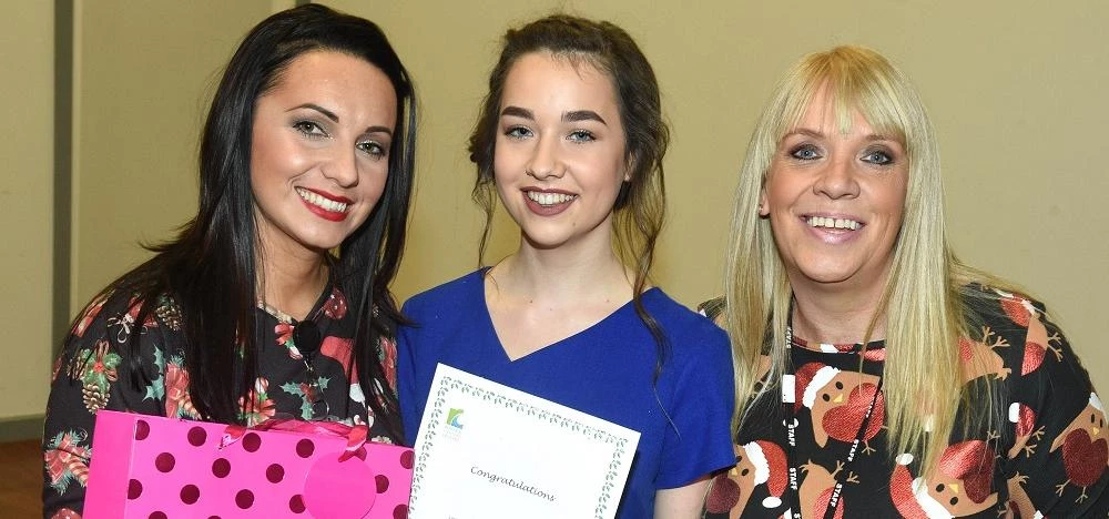 Overall winner Tiffany Roots (middle, blue top) celebrates her success