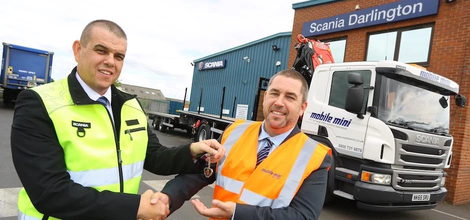 Left to right Alan Dale, Regional Sales Manager, Scania hands over the keys to Chris Watcham, Health
