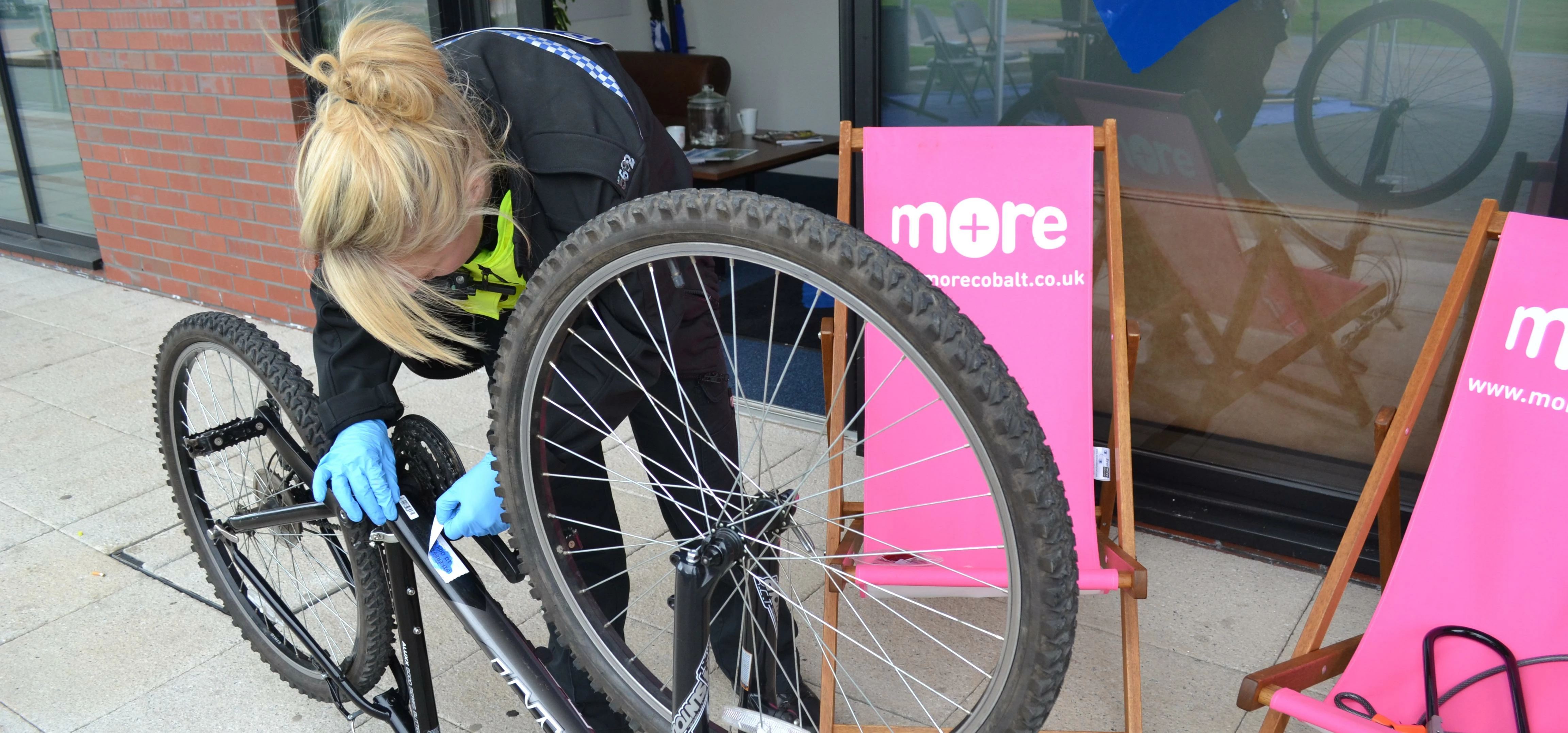 Kate Graham carrying out free security bike marking at the Cobalt Business Park