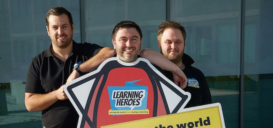 Adam Kara (centre) with members of the Learning Heroes team