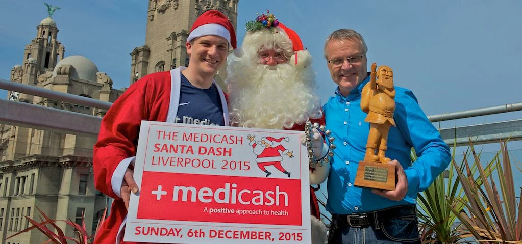 Andy Abernethy from title sponsor Medicash, Santa, and BTR Liverpool's Alan Rothwell. Picture by Pau
