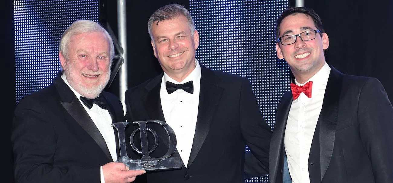 Pictured: Crawford Healthcare CEO Richard Anderson (centre) receiving an award earlier this year