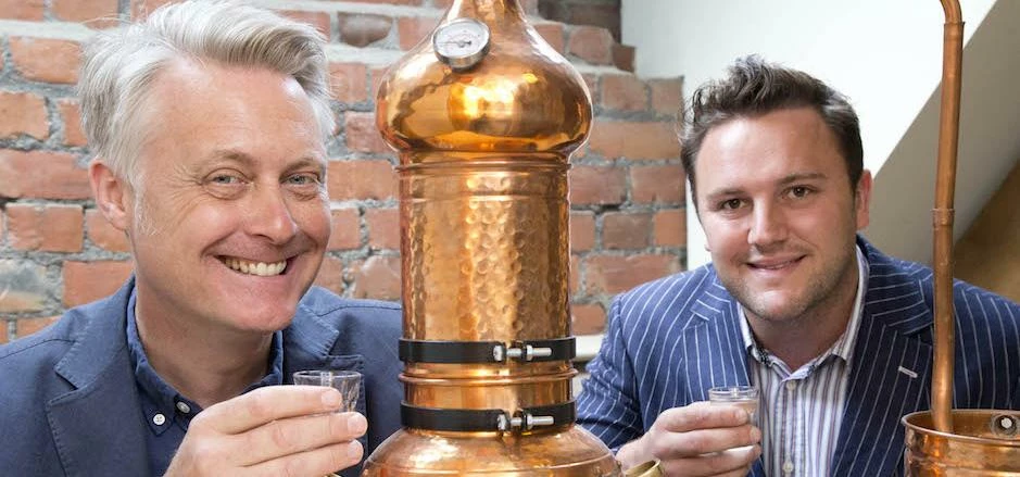 Newcastle Gin Company directors Jon Chadwick and Harry Vaulkhard with a miniature version of the 400