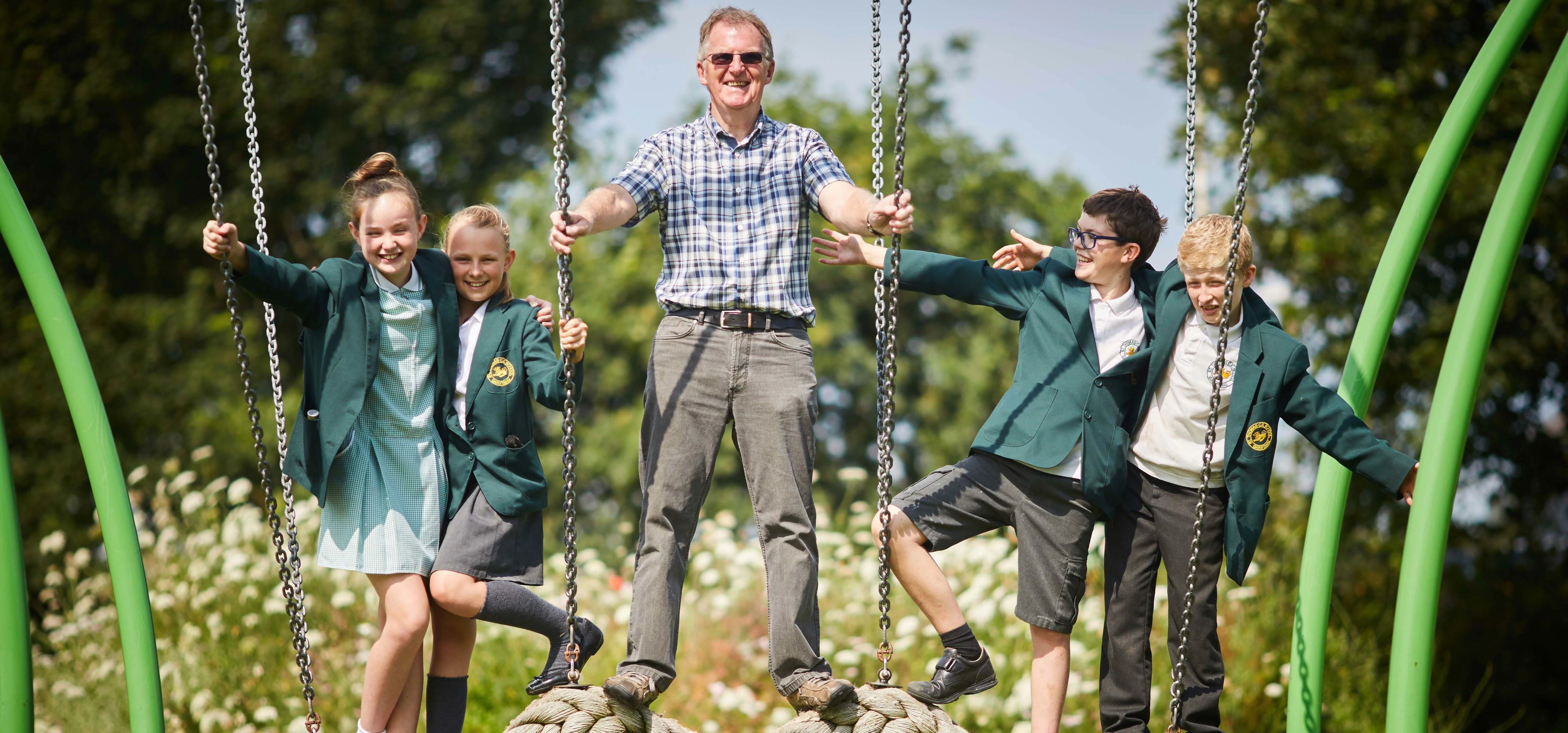 Pictured Gordon Harter, Trust Chairman, Gordon Harter, along with children from the local school St