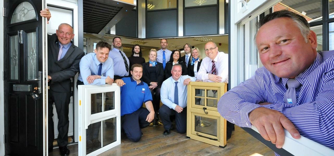 Happy staff and Directors at Pennine Home Improvements 