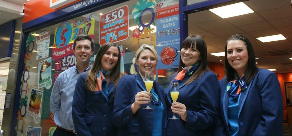 Staff from Dawson & Sanderson celebrate the opening of the travel agency’s new branch