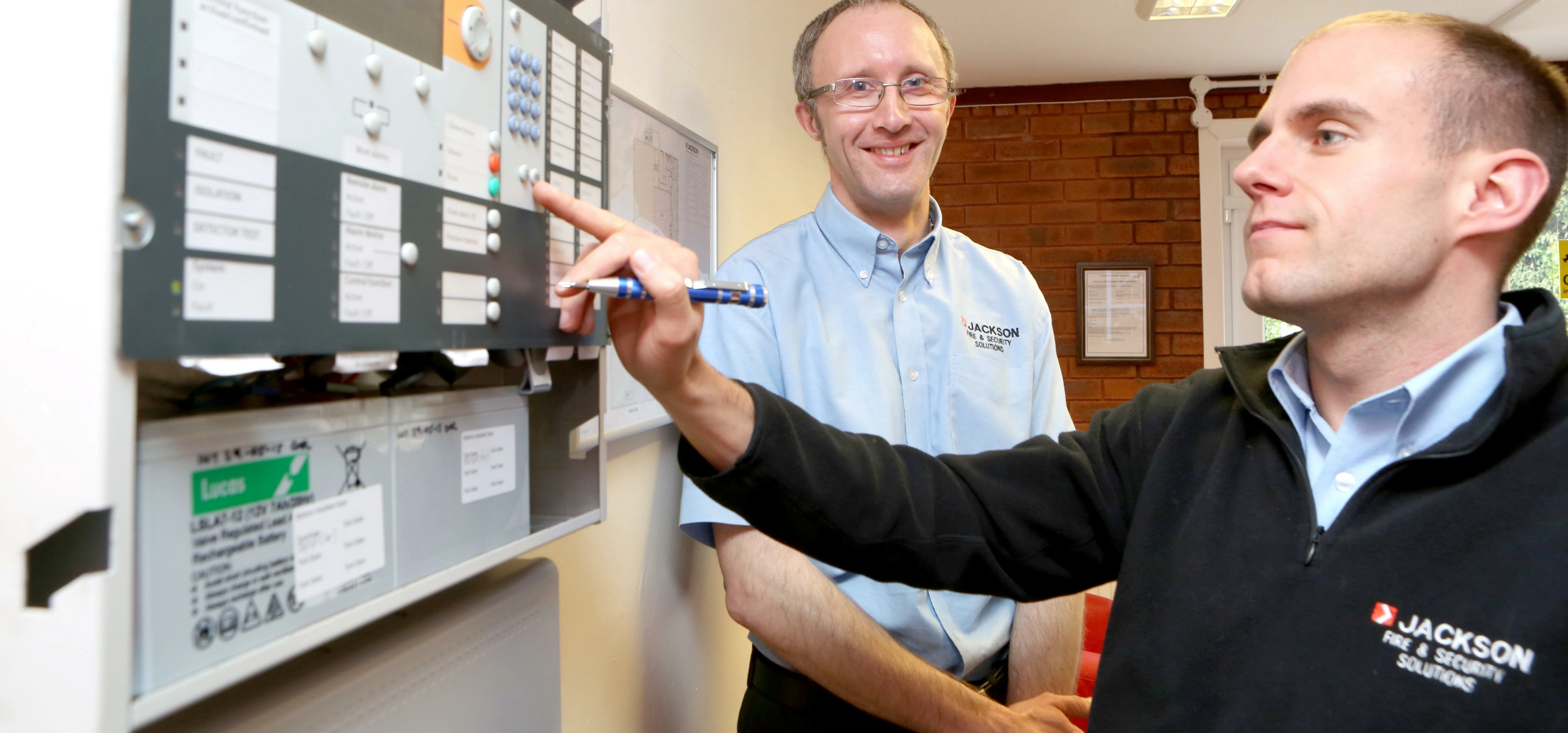 Head of Jackson Fire & Security’s new quality, audit and training, Stan Dancy, puts colleague Chris