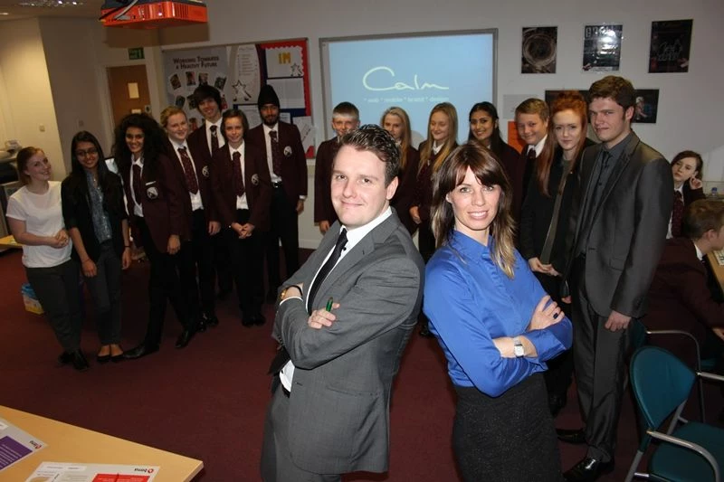 Teacher Adrian King from Macmillan Academy with Calm Digital's Bianca Robinson and pupils