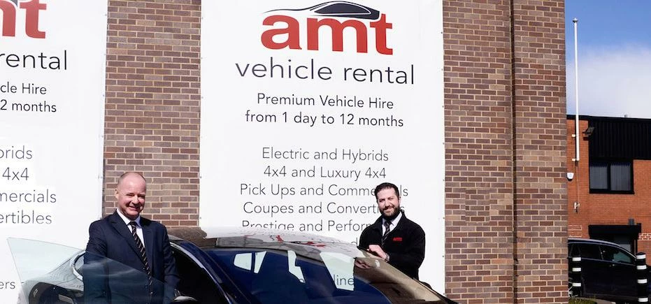 Andy Crinson (left) and Simon Rawlings of AMT Vehicle Rental with the Tesla.
