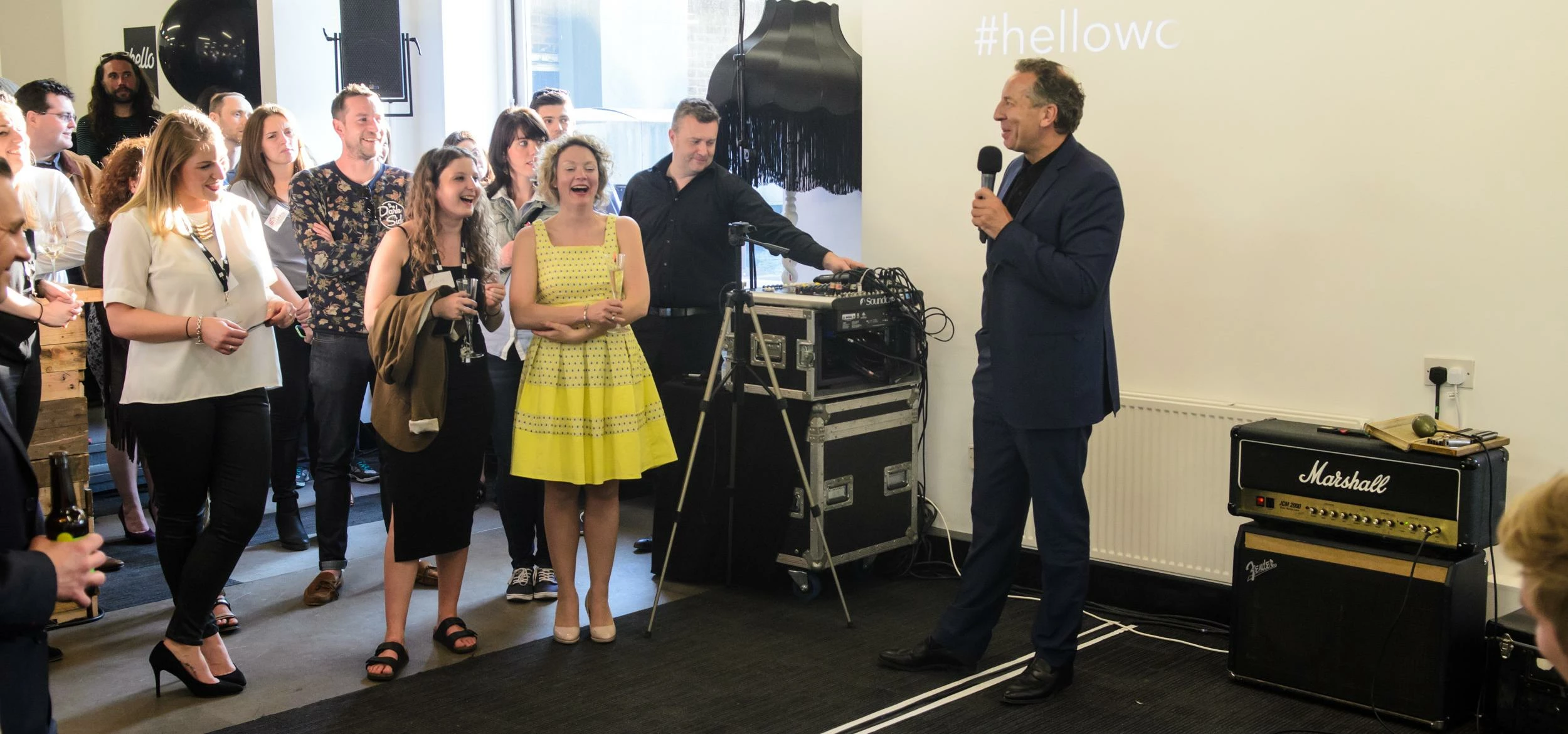Hello Work Founder, Michael Ingall, welcomes guests to First Birthday Open House