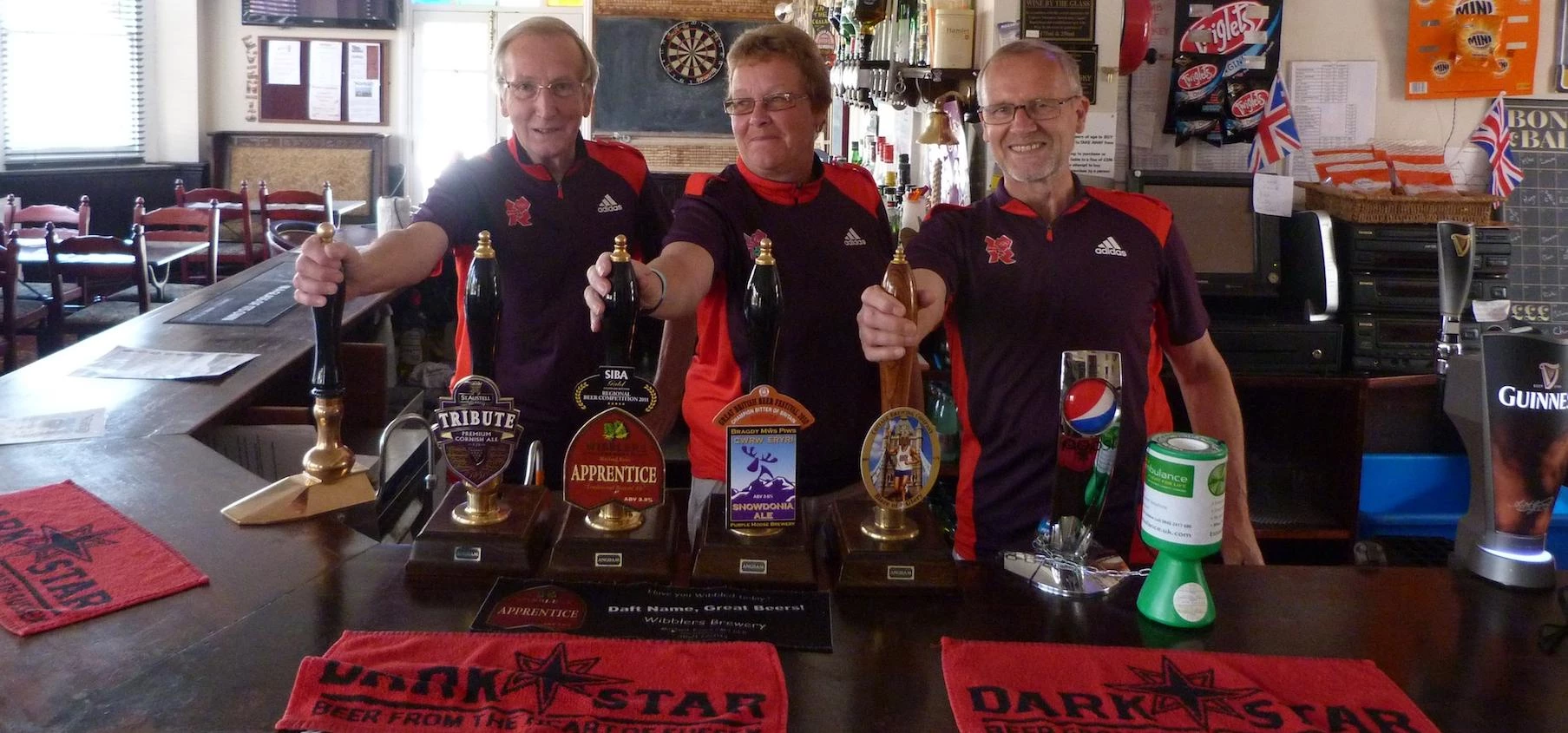 Norton Community Pub volunteers celebrate the pub's opening