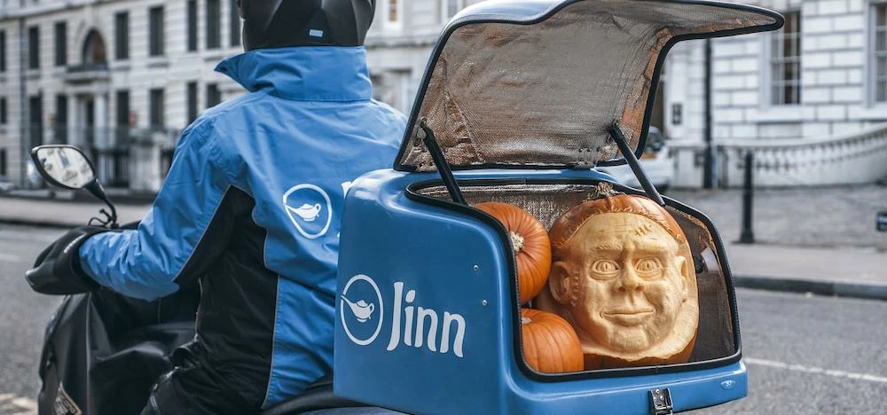 A Jinn driver delivering one of the firm's limited edition carved pumpkins.