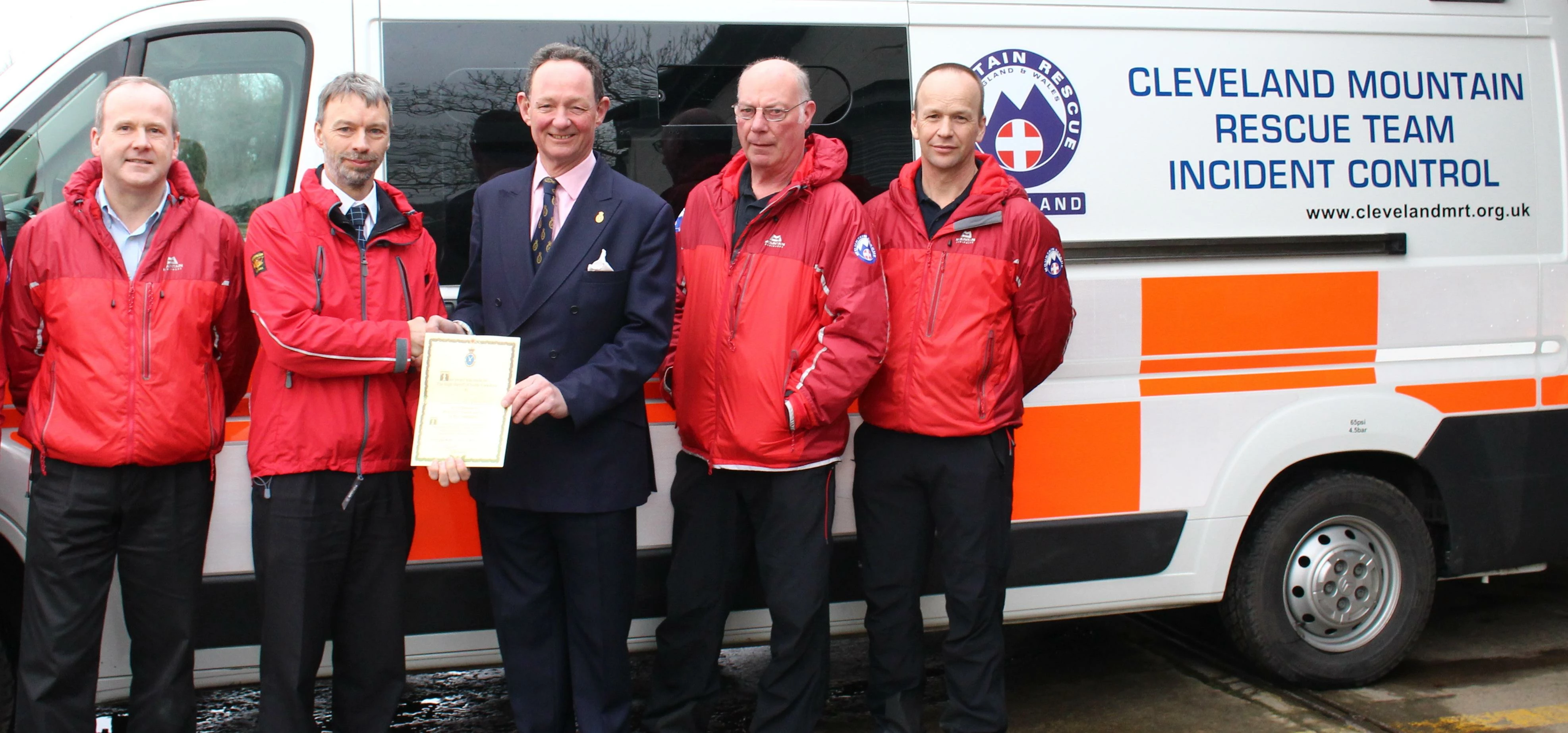 Charlie Forbes Adam, the High Sheriff of North Yorkshire, with members of the Cleveland Mountain Res