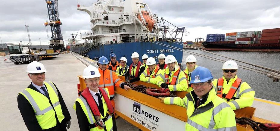 Mark Pearson, Group Projects Director (Front row right) stands on the reconstructed quay with the te