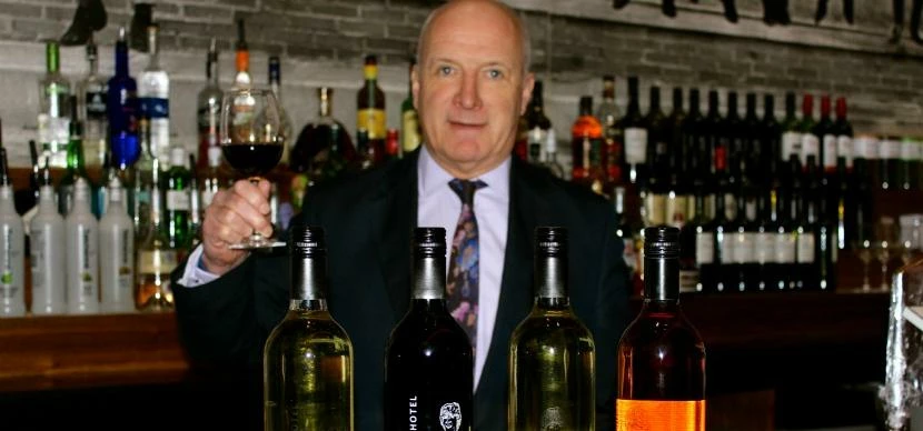 Mike Dewey, GM at Hard Days Night Hotel with the Fab Four wines 