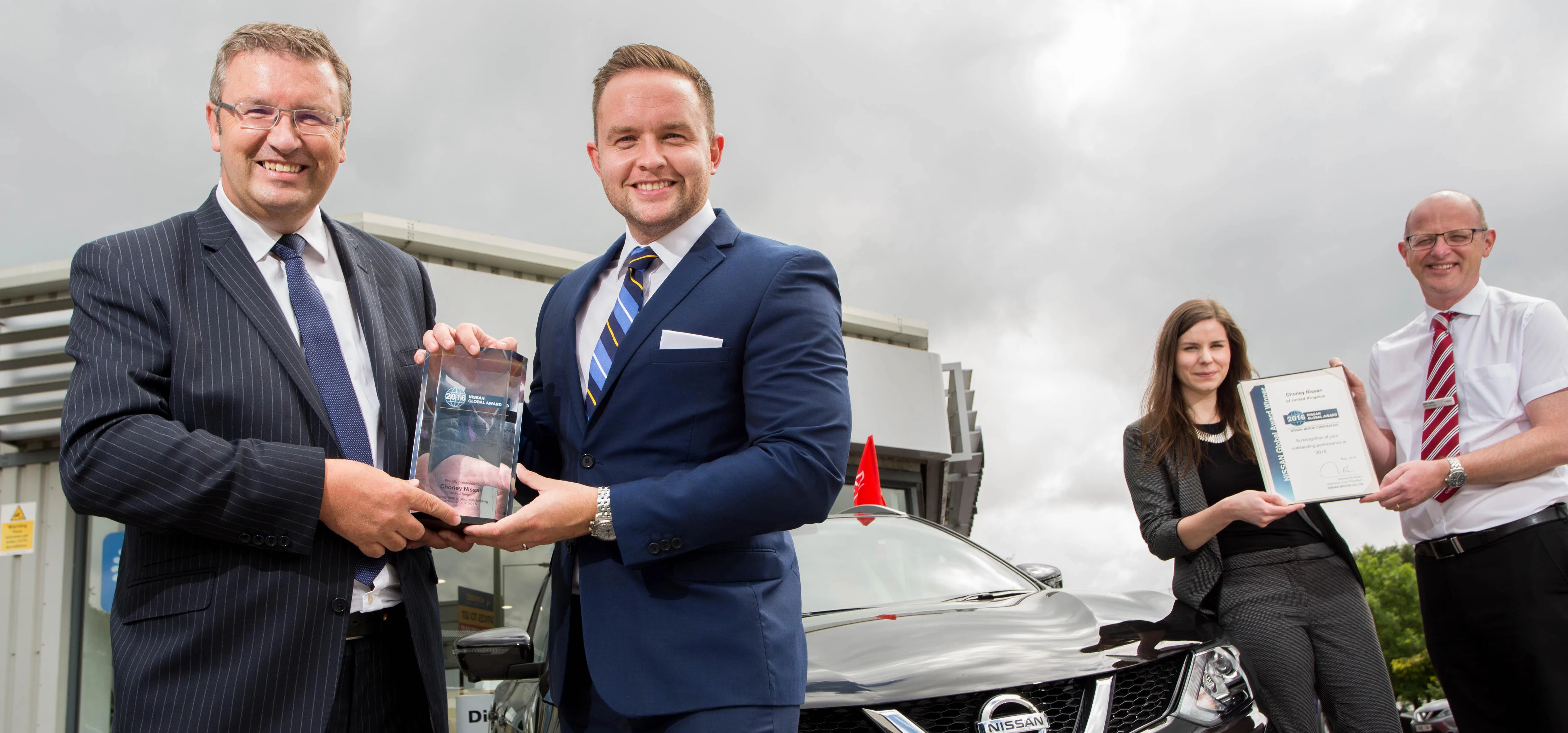 Picture caption: Charlie Caldwell (Regional Director, Nissan), left, presents Chorley Group Sales Di