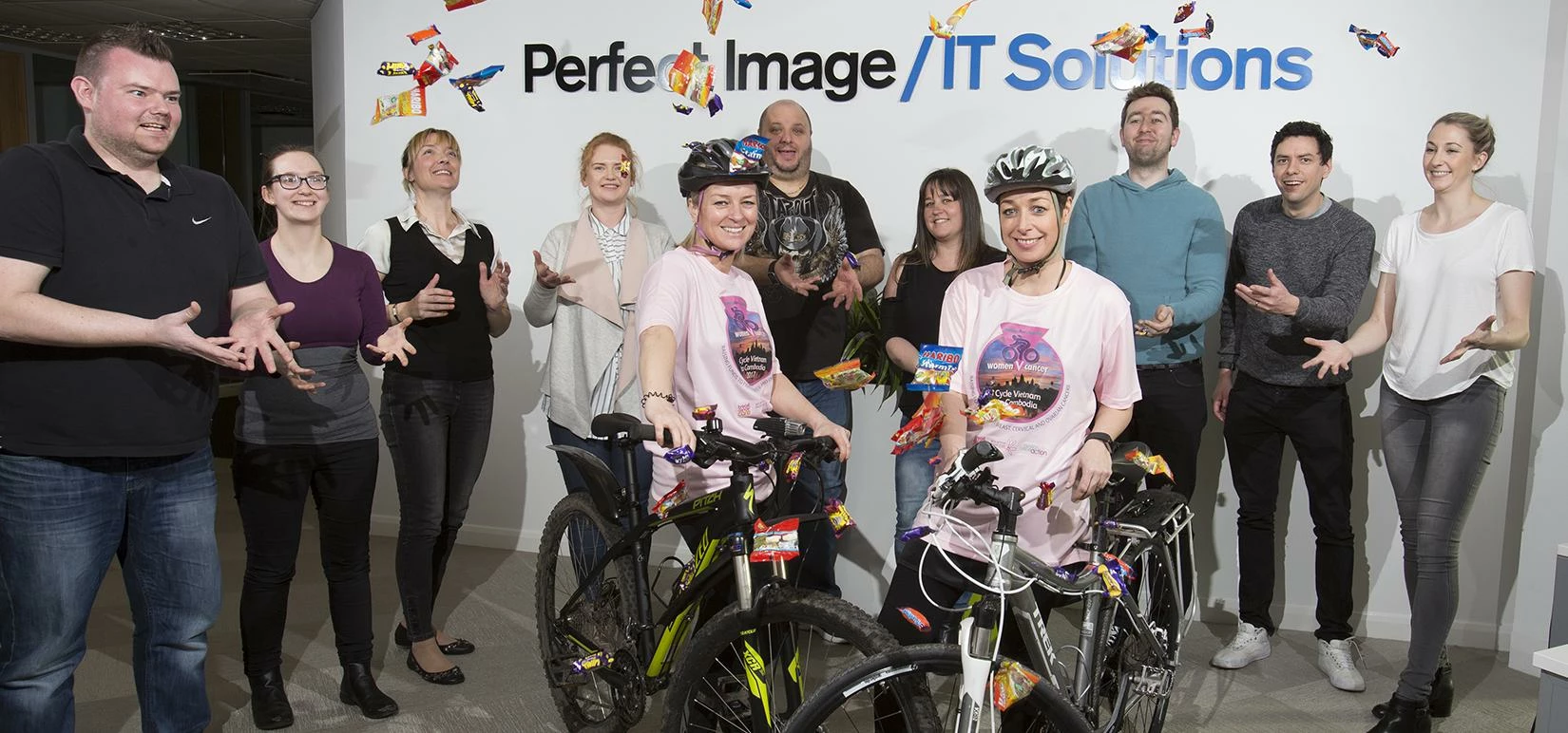 Gail McCamley (left) and Kay Lees (right) with members of the Perfect Image team