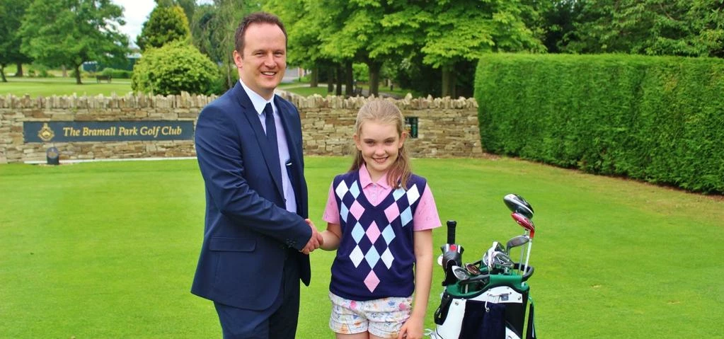 Williams Group Marketing Manager Aidan Williams presents Josie with the sponsorship