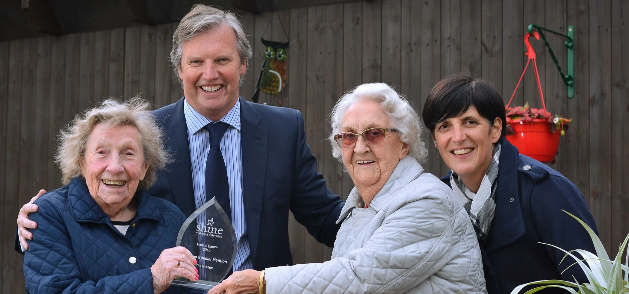 The Grange residents with Buckshaw director Phil Hill and activity coordinator Alison Evans, collect