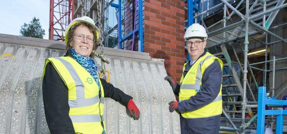 Cllr Judith Blake and Edward Ziff removing the final concrete panel on the Merrion House redevelopme