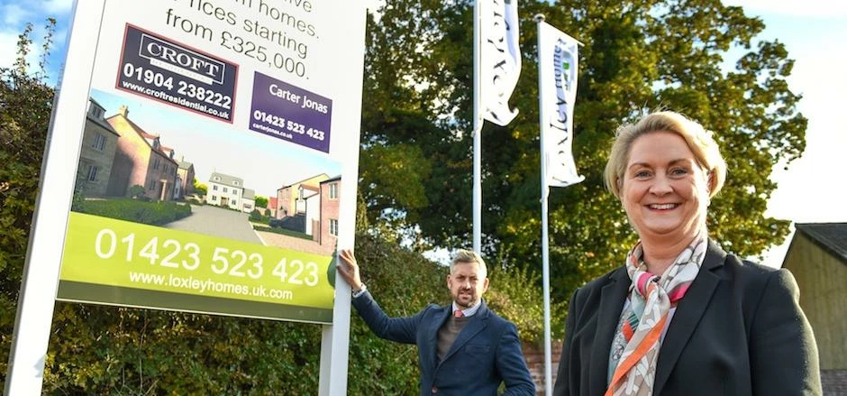 Anne Haggas, Carter Jonas; Toby Cockcroft, Croft Residential, on site at the new Meadowside developm