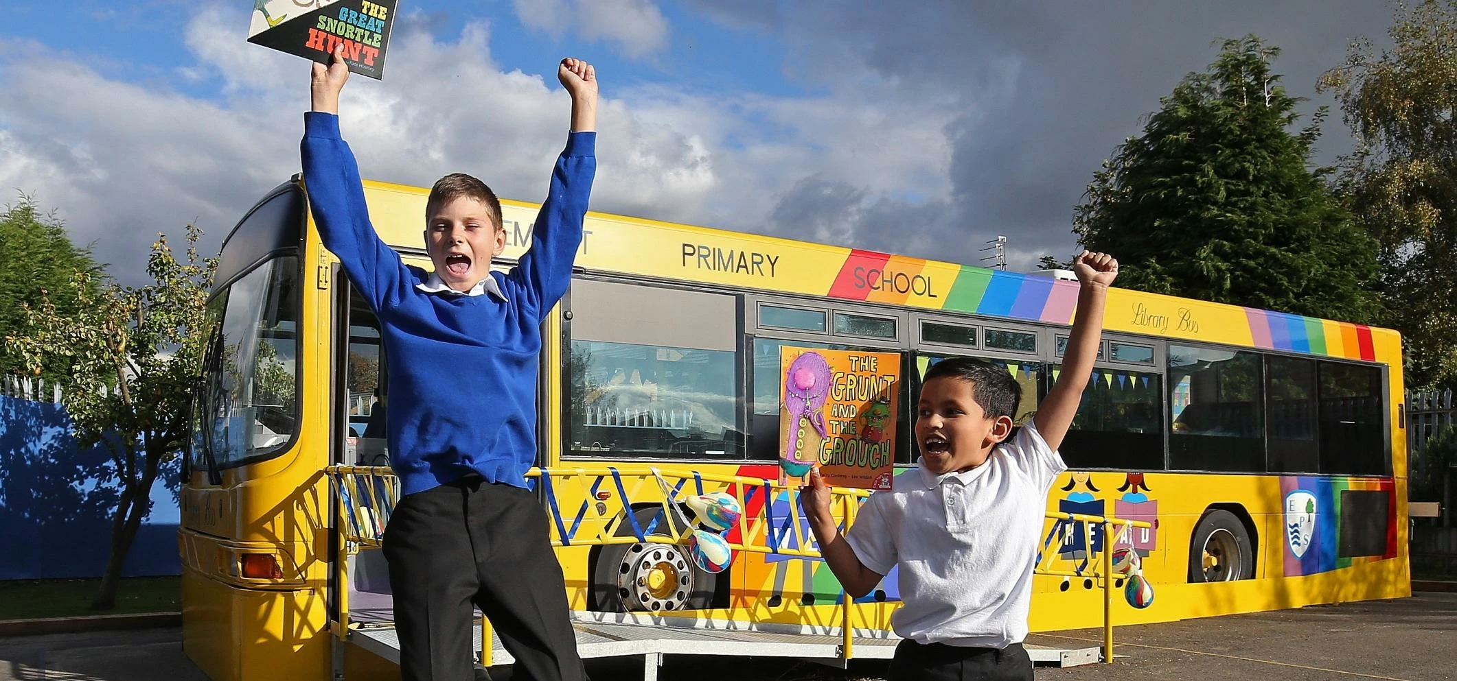 Children from Egremont Primary jump for joy at their new bus library