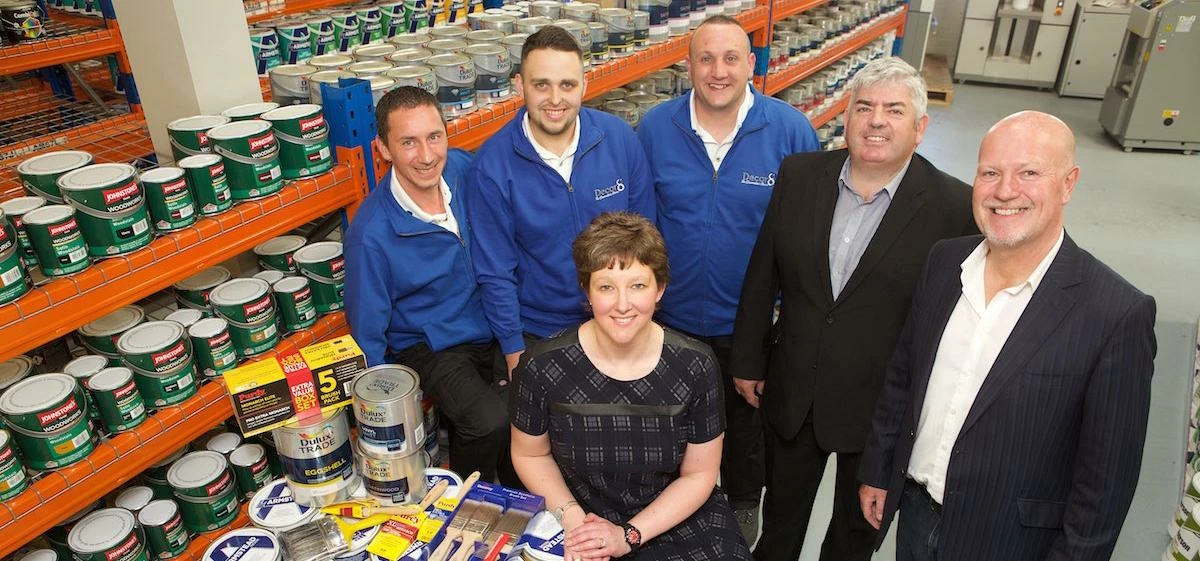 L-R: Decor8 employees Robert Bowes and Ryan Porter, with NatWest's Helen Smith (seated) and Decor8's