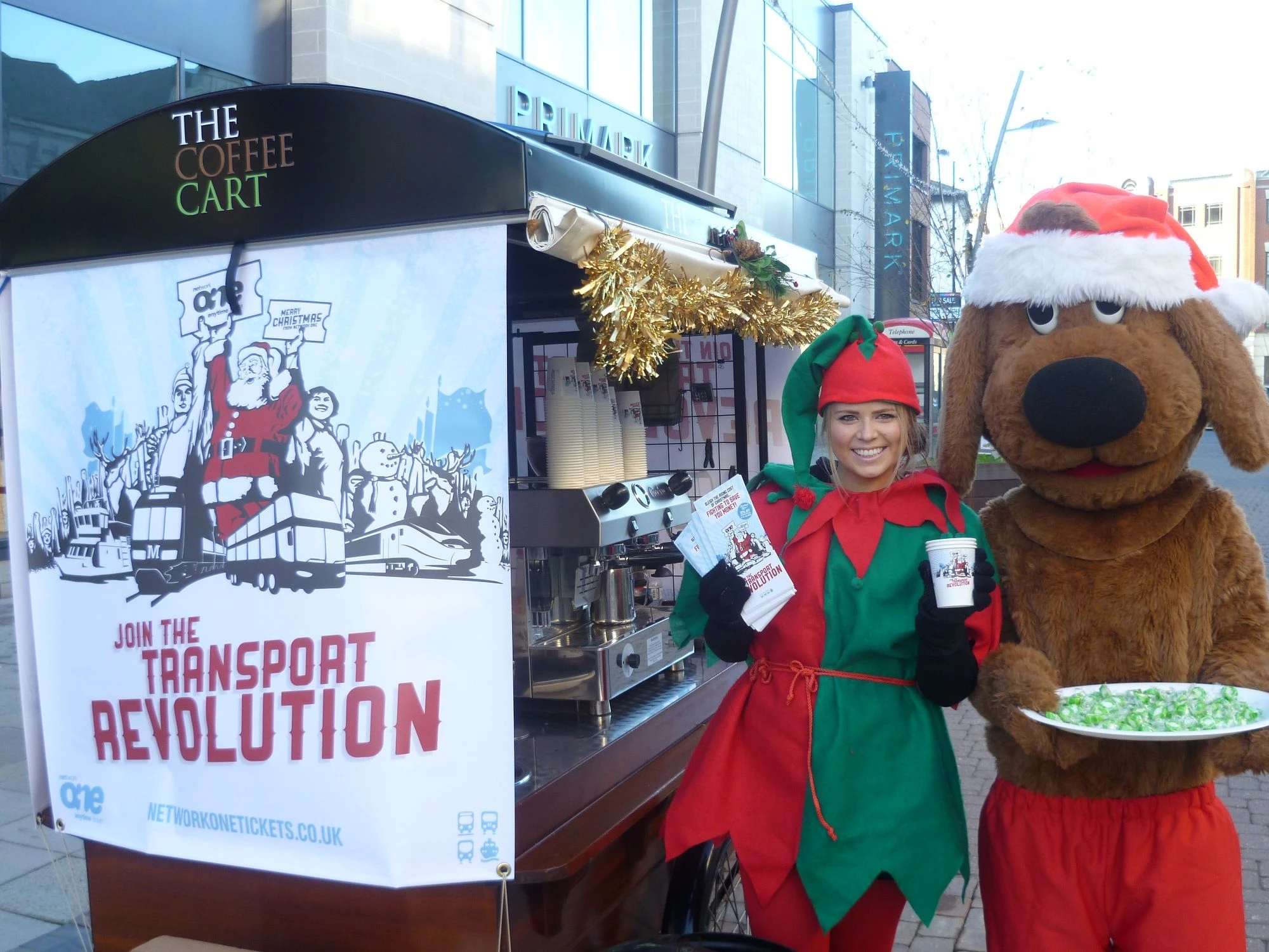 Rover the dog and elf with the Network One coffee cart