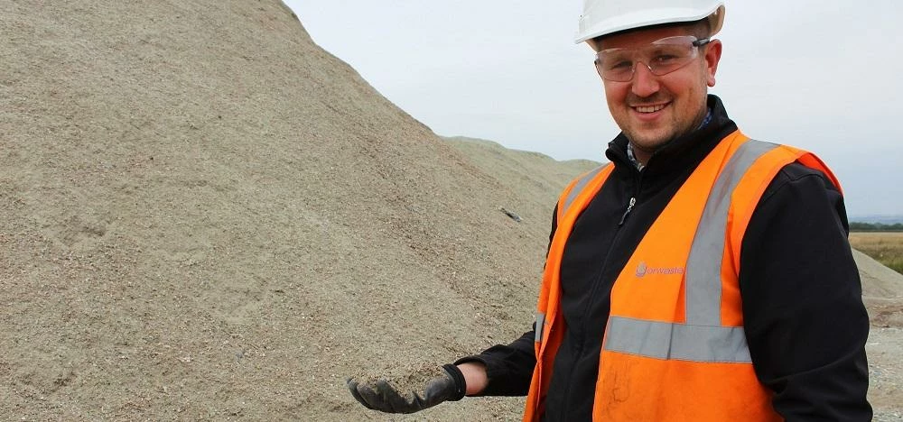 Materials Recycling Facility Manager Simon Marshall with the glass material produced by Yorwaste.