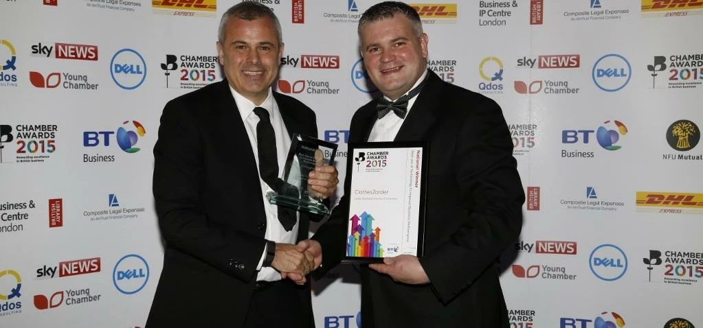 Michael Conway, left, managing director of Clothes2order.com, receives the award from Danny Longbott