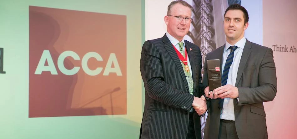 Barry Gill (right), founder of the company, receiving his UK Advocate of the Year Award 2016 by the 