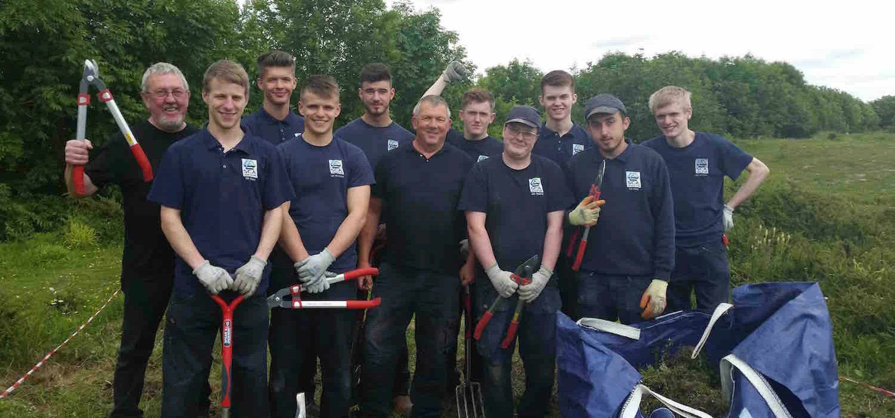 Dr Keith Shaw with apprentice volunteers from SCA