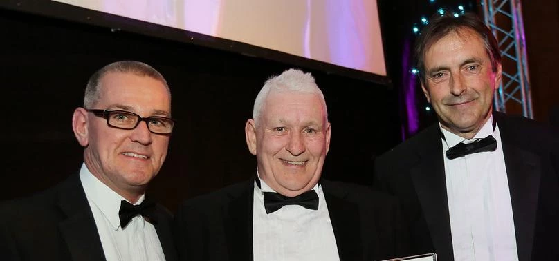 Adrian Hill (centre) picks up his CIH Tenant Board Member of the Year Award