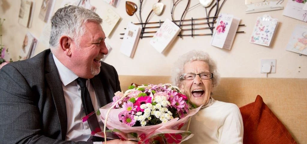 One Vision Housing Managing Director Jed Pearson with 100-year-old customer Kathleen