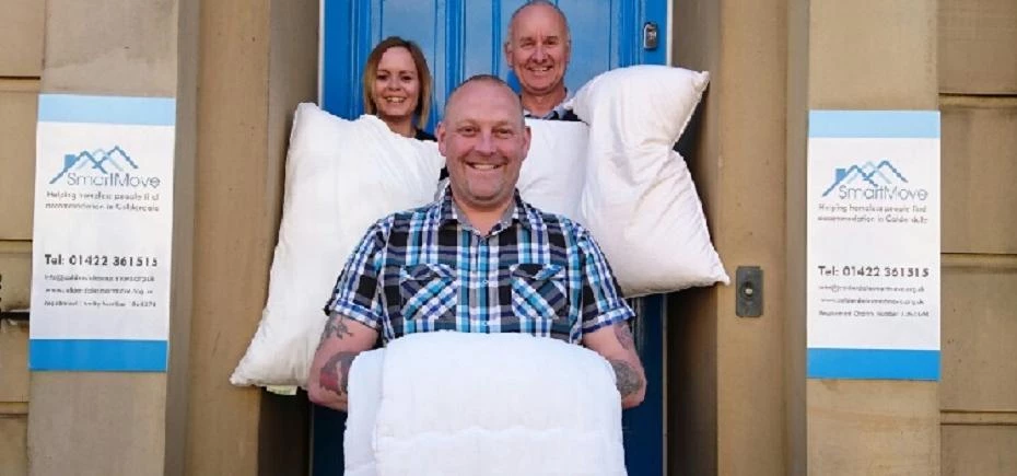 Staff at Calderdale Smartmove with the Duvets and Pillows
