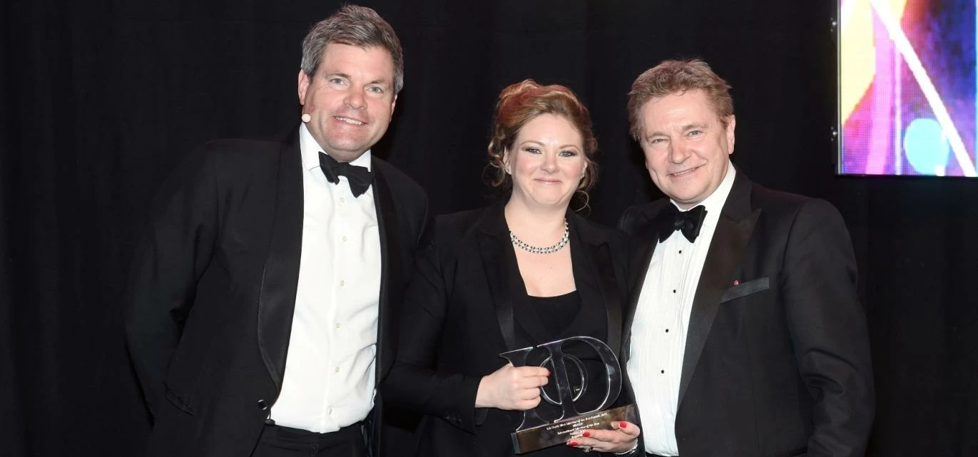 Emma Sheldon is pictured receiving her Institute of Directors' Award from TV presenter Mark Durden-S