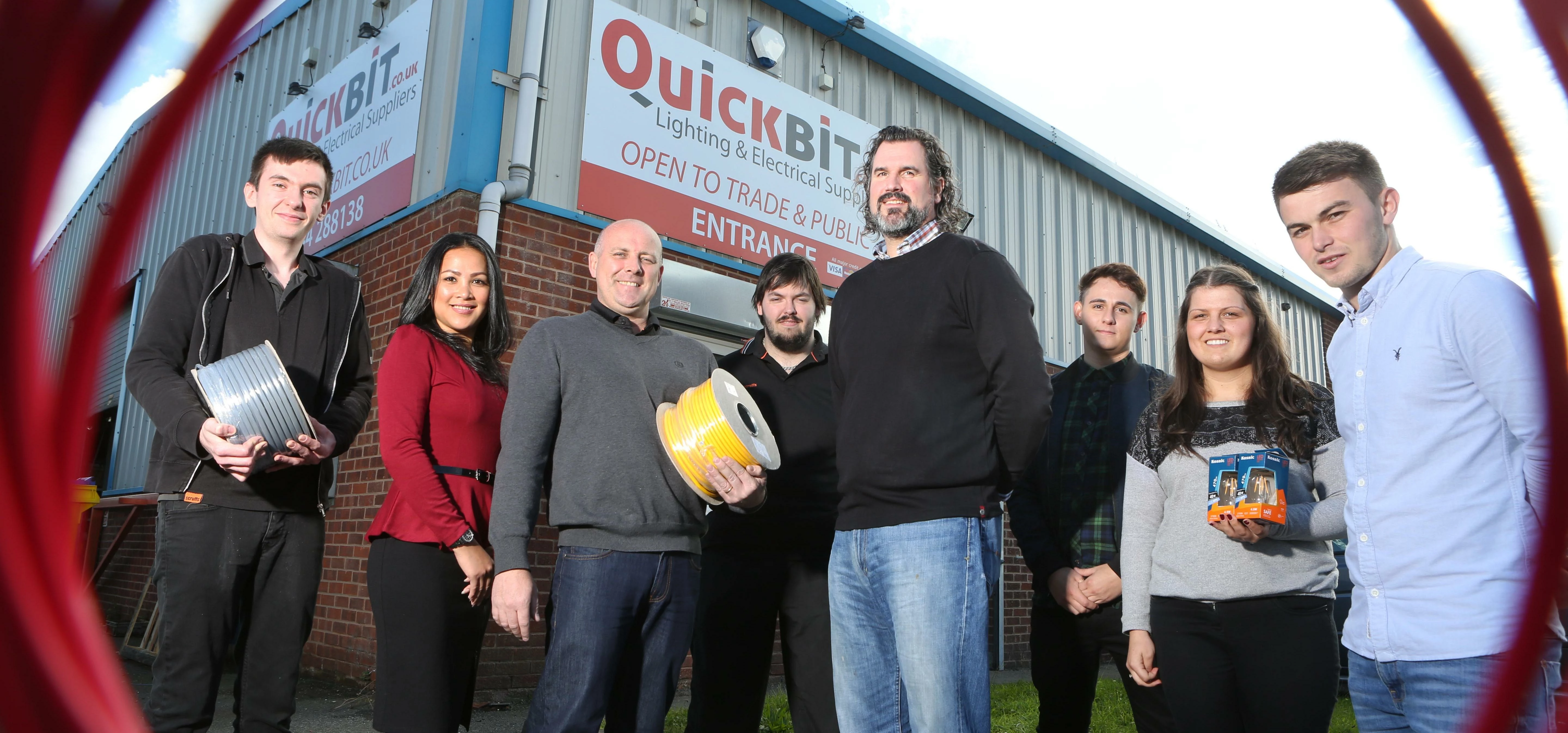 Stuart and Lee Guy with business partner David Baker (centre) and the Quickbit team at the Deeside I