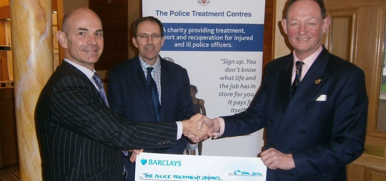 Col Patrick Cairns of the PTCs received a cheque from David Garfitt and Charlie Forbes Adam