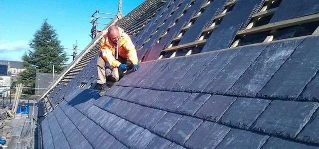 Martin-Brooks’ Darren Green laying Welsh slate on the south nave roof at St Mary’s Church in Walkley