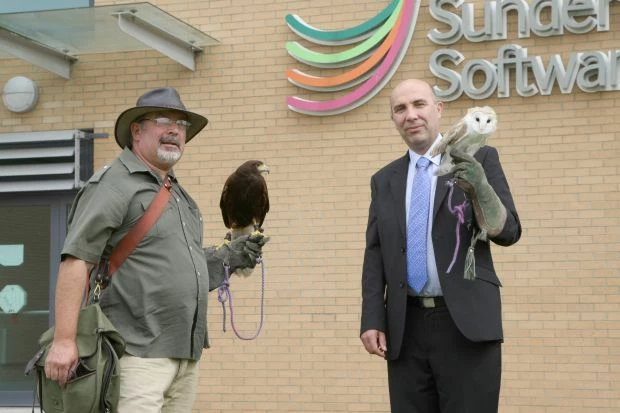 Phil Niall (left) and David Cliff with two of the birds from Durham Falconry