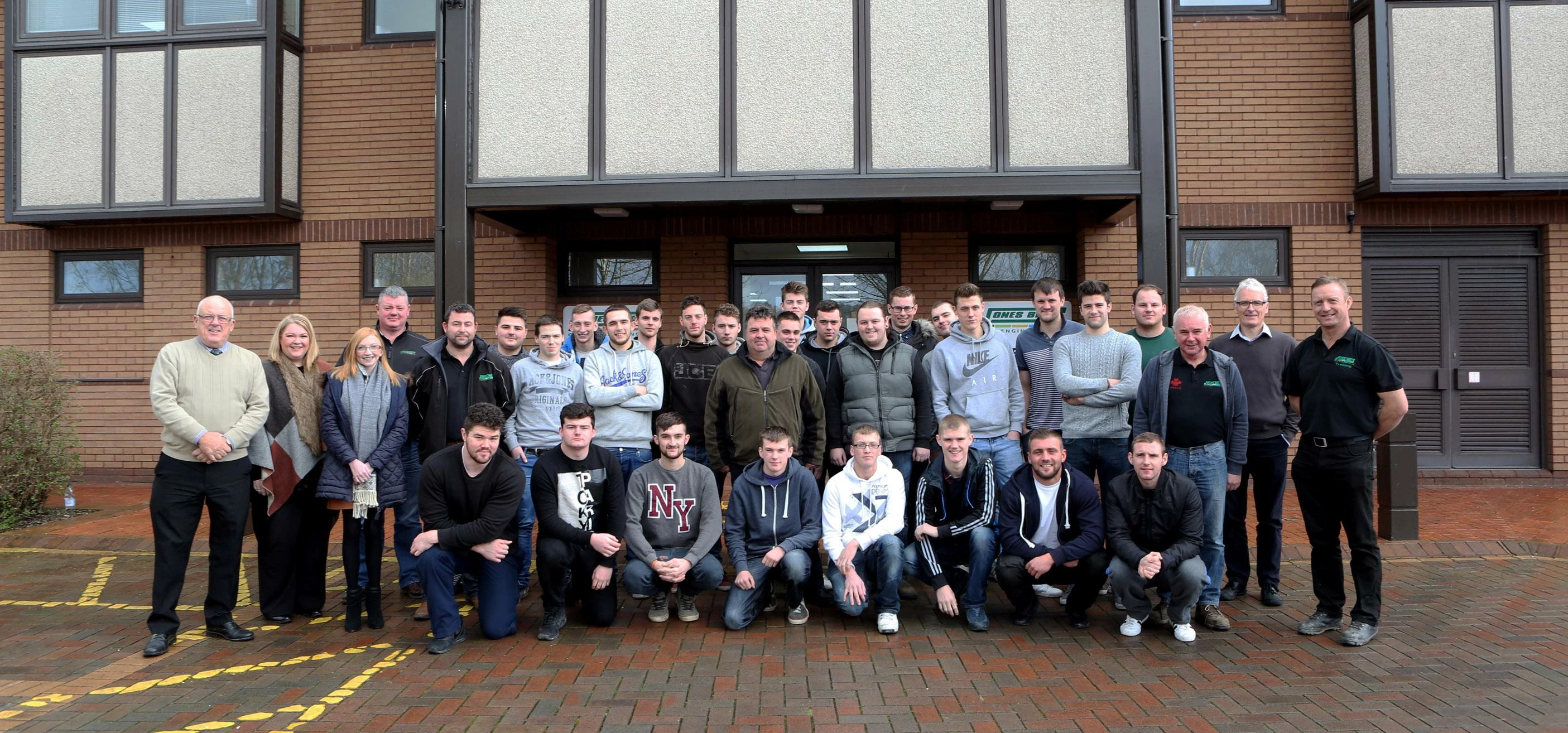 Jones Bros’ current crop of apprentices with staff from the training department.