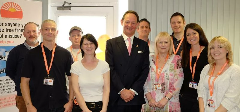 Charlie Forbes Adam, the High Sheriff of North Yorkshire (centre) with volunteers and employees of t